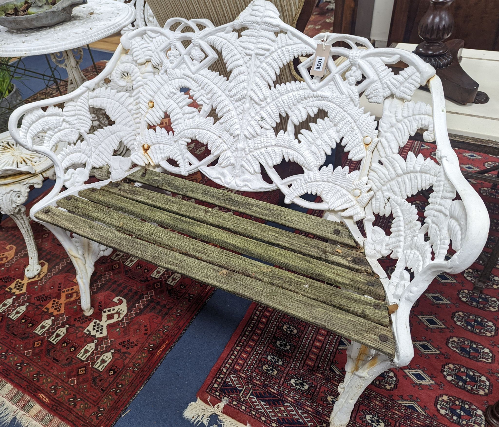 A Victorian Coalbrookdale design painted cast iron fern pattern garden bench, length 114cm, depth 44cm, height 90cm